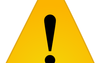 Ausrufezeichen in gelbem Warndreieeck.